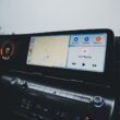 Car dashboard showcasing a modern infotainment system with GPS navigation and climate controls.