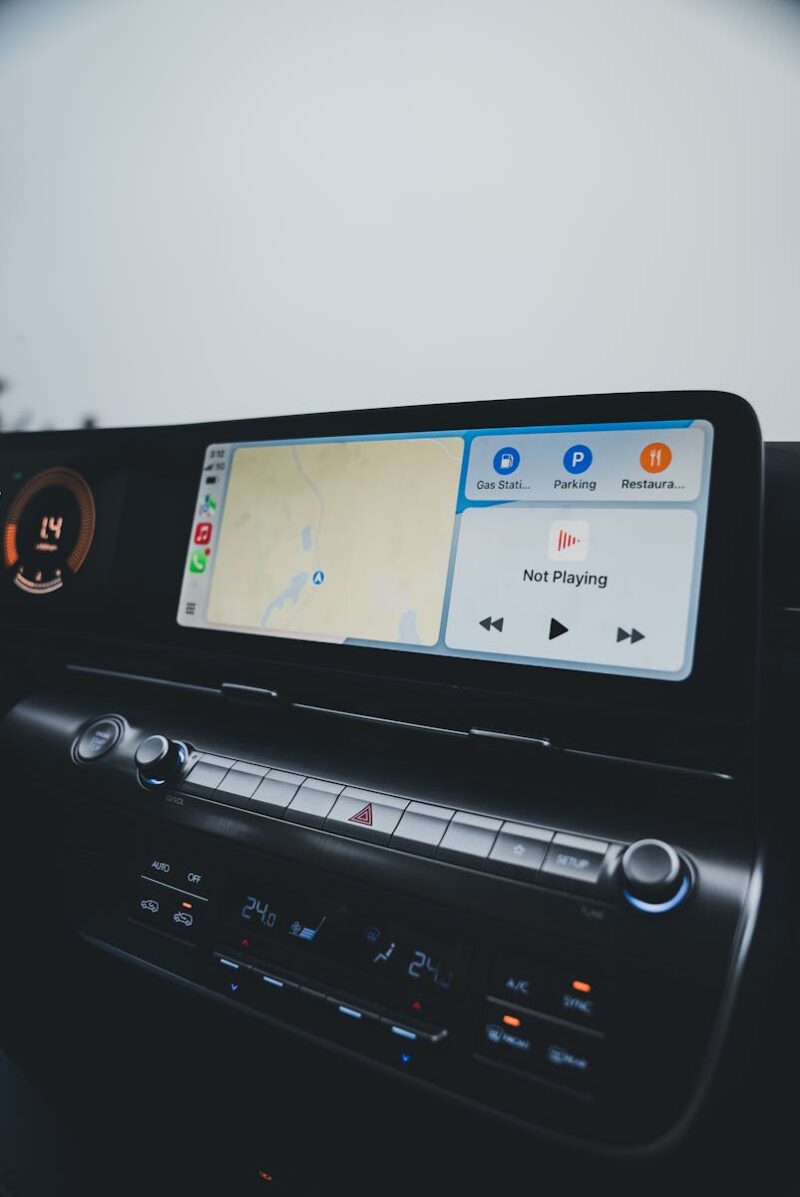 Car dashboard showcasing a modern infotainment system with GPS navigation and climate controls.