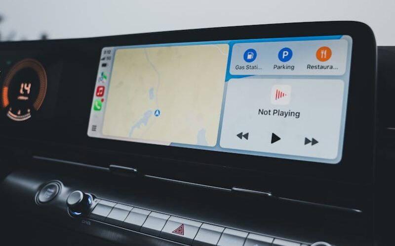 Car dashboard showcasing a modern infotainment system with GPS navigation and climate controls.