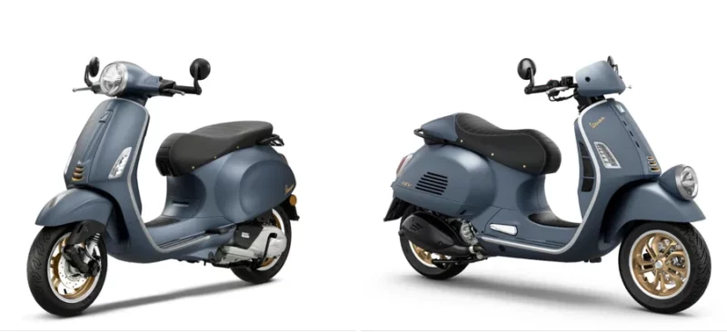 doua scutere vespa de culoare albastra unul langa altul