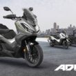 poster cu 4 scutere honda si cu un oras in fundal